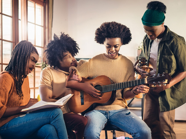Person writing poetry outdoors