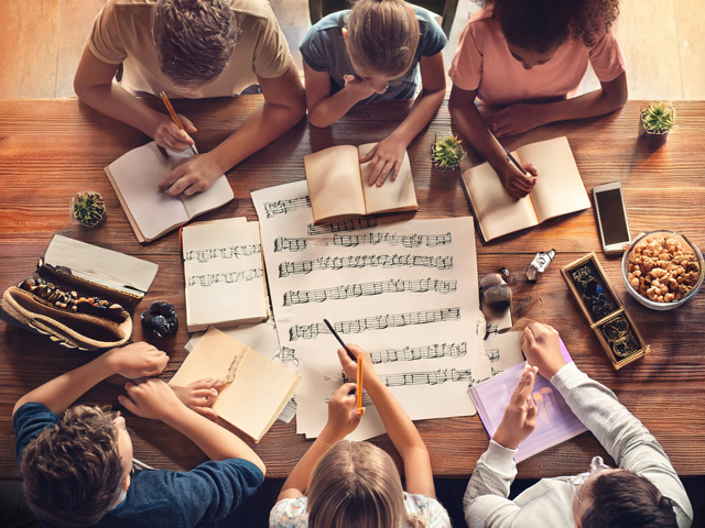 Group writing poetry together